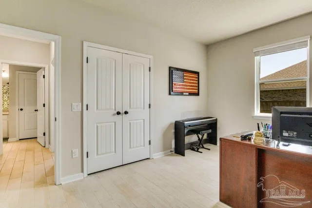 a view of a livingroom with furniture and a window