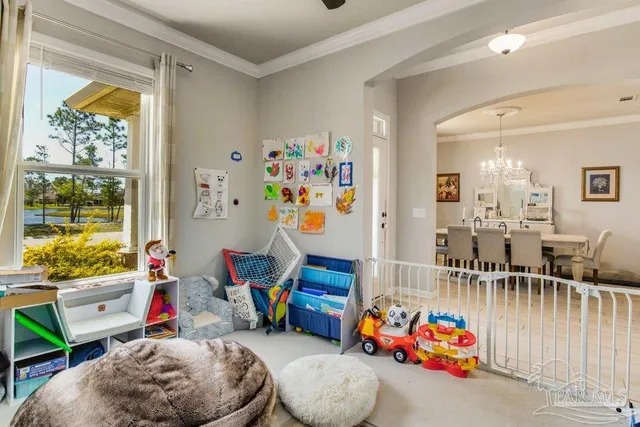 a living room with lots of baby toys