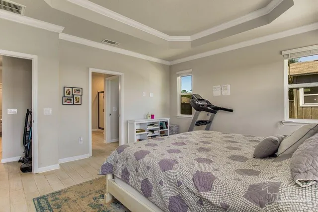 a bedroom with a bed and a dresser