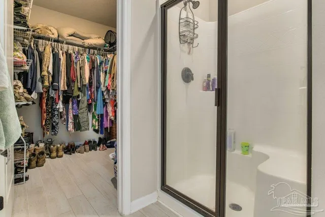 a en suite bathroom with double sink and a mirror