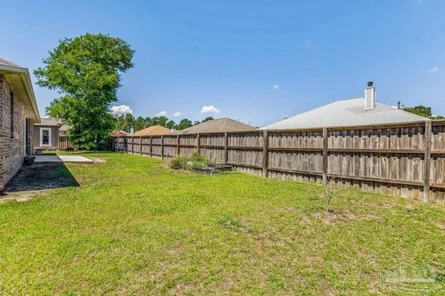 a front view of a house with outdoor seating