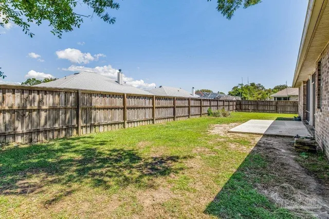 a view of a house with backyard porch and garden