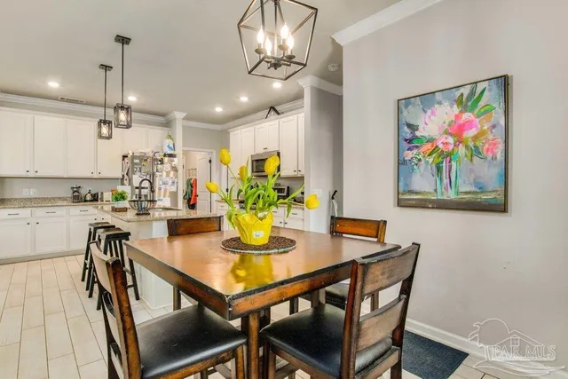 a view of a dining room with furniture