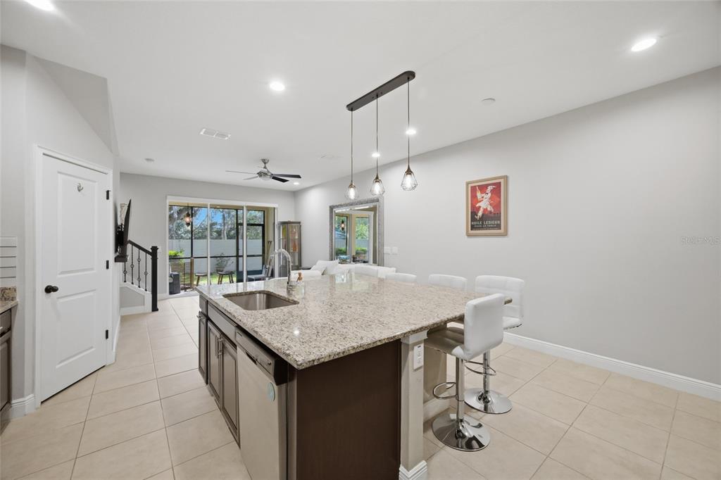 2013 Sunset Wind Loop Oldsmar, FL 34677 - Photo 8 of 43 a room with a table and chairs