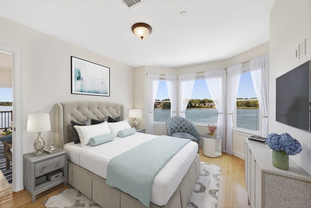 43 March Street, Unit 3 Salem, MA 01970 - Photo 3 of 10 a bedroom with a bed and a flat screen tv