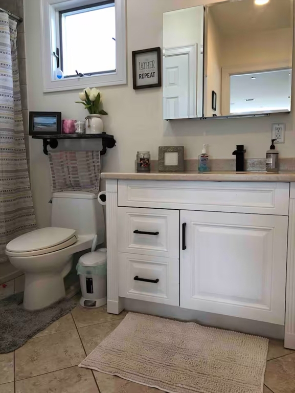 43 March Street, Unit 3 Salem, MA 01970 - Photo 7 of 10 a bathroom with a toilet sink and mirror