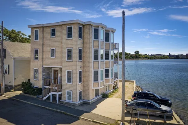 a front view of a house with lake view