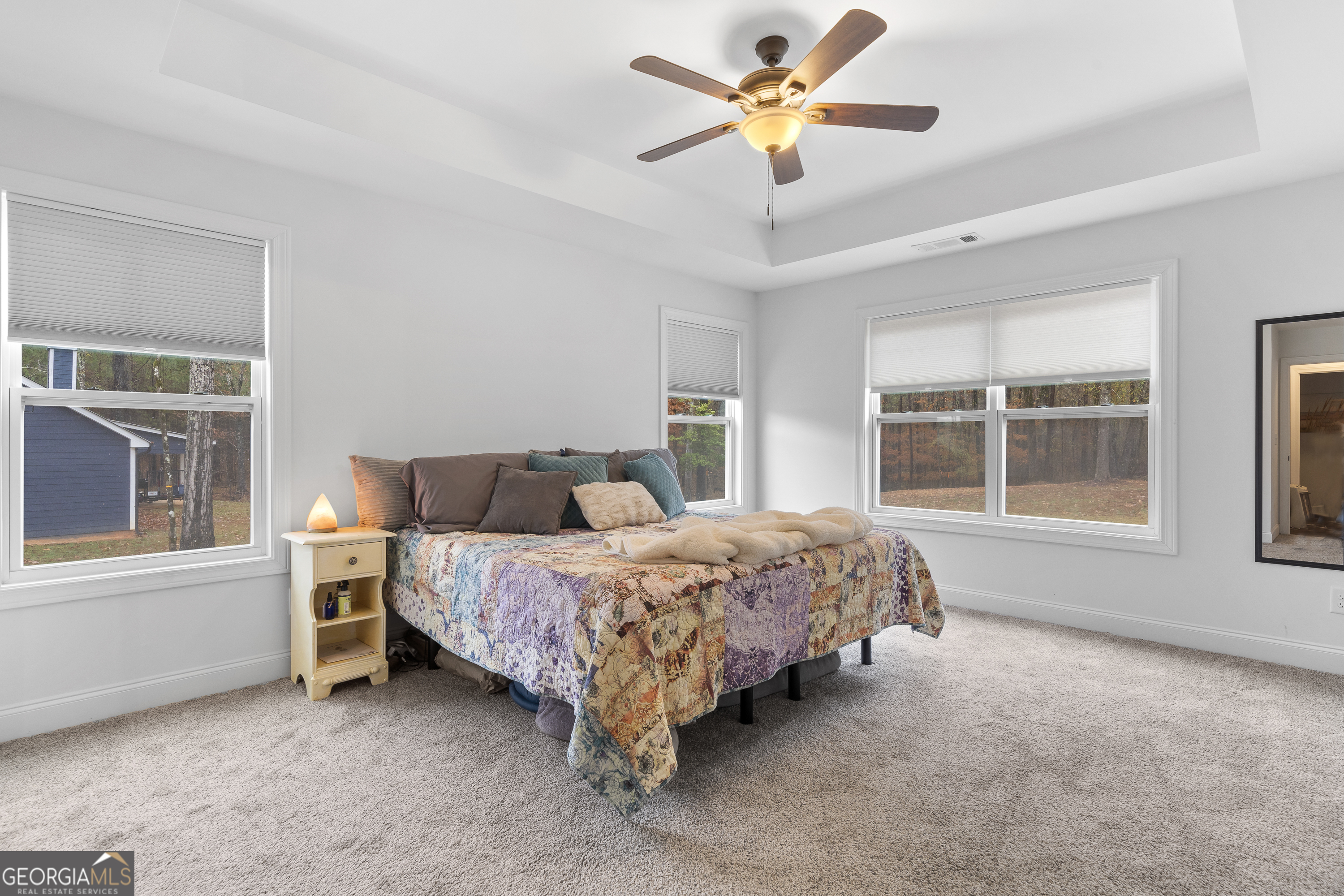 149 Willow Forest Road Milledgeville, GA 31061 - Photo 11 of 52 a spacious bedroom with a bed and a large window