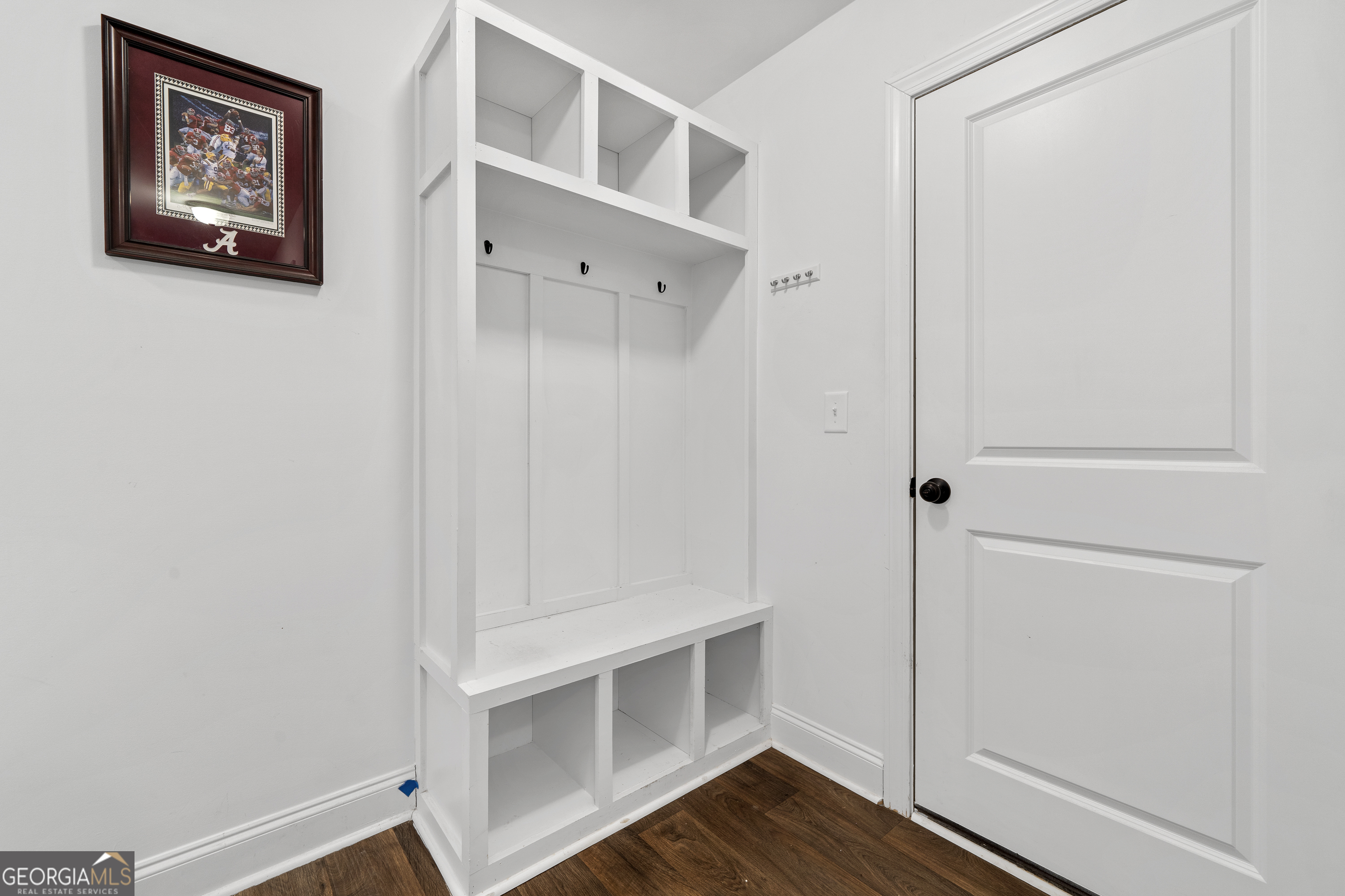 149 Willow Forest Road Milledgeville, GA 31061 - Photo 12 of 52 a view of an empty room with wooden floor
