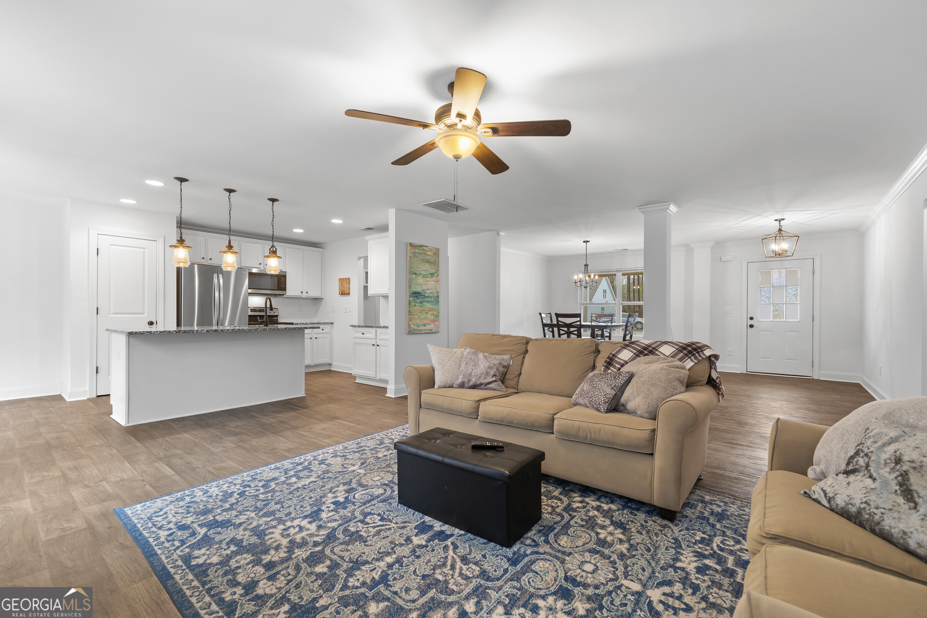 149 Willow Forest Road Milledgeville, GA 31061 - Photo 21 of 52 a living room with furniture kitchen view and a chandelier