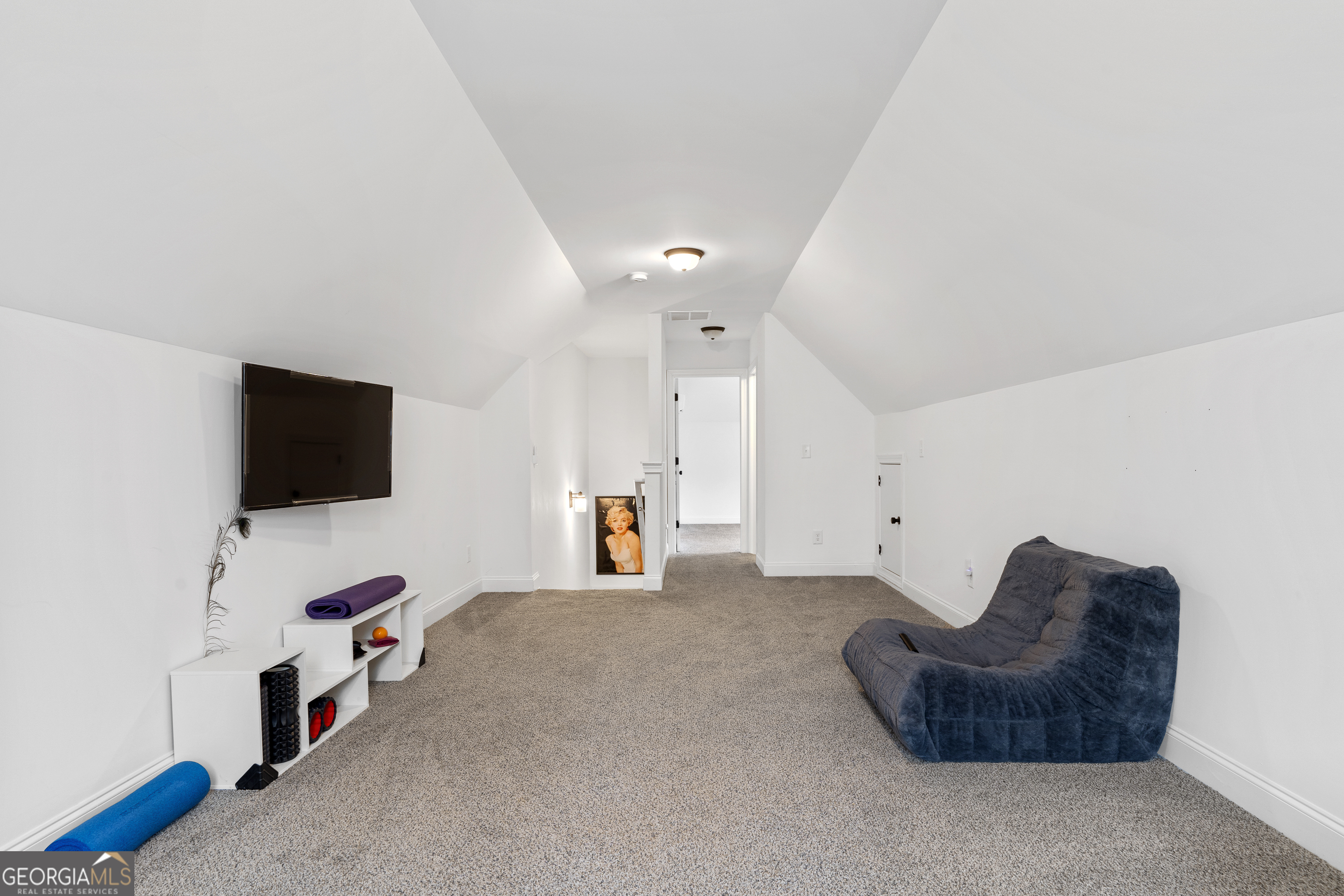 149 Willow Forest Road Milledgeville, GA 31061 - Photo 46 of 52 a living room with furniture and a flat screen tv