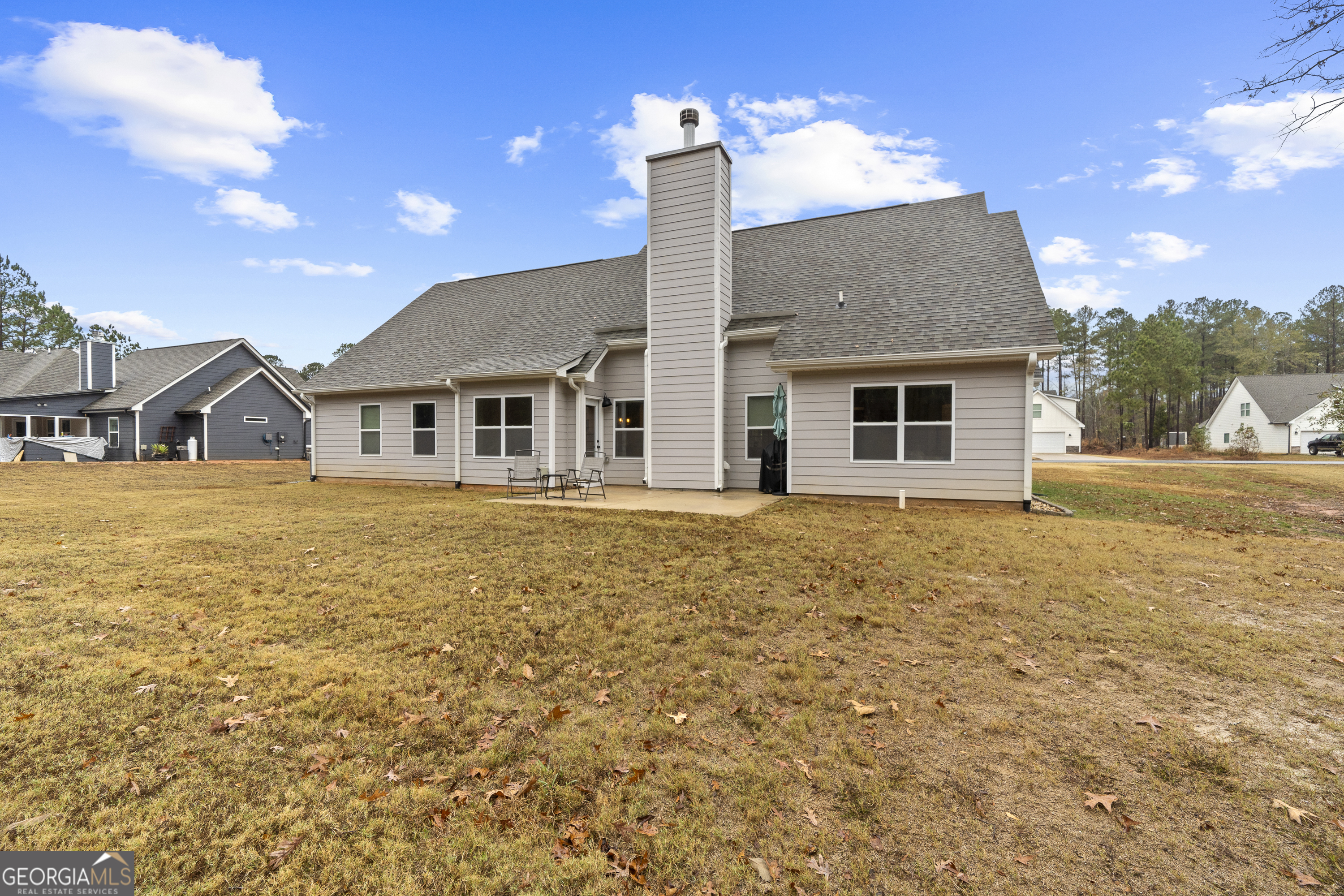 149 Willow Forest Road Milledgeville, GA 31061 - Photo 50 of 52 a front view of a house with a garden and yard