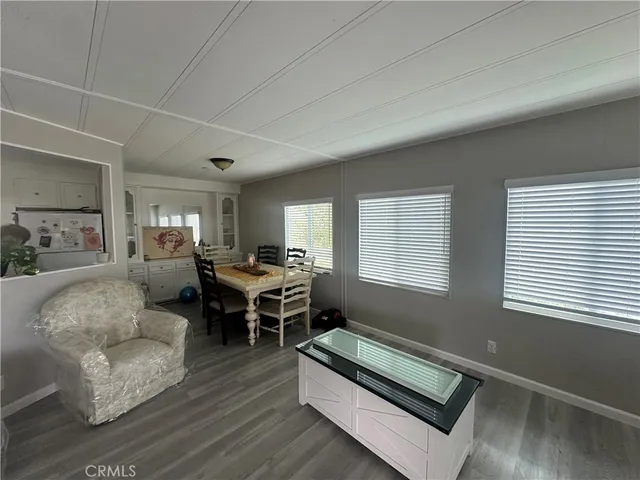 a living room with furniture rug and window