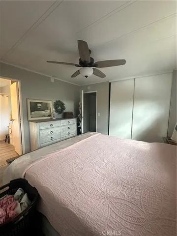 a bedroom with a bed and a dresser