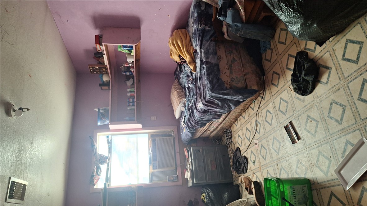 3571 Winding Road Hearne, TX 77859 - Photo 12 of 14 a bedroom with a bed and a mirror