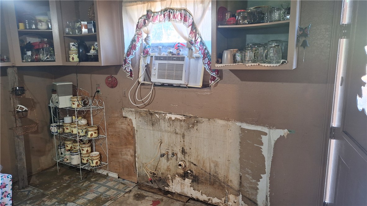 3571 Winding Road Hearne, TX 77859 - Photo 4 of 14 a room with multiple racks and a window