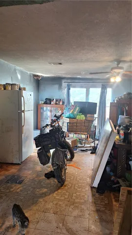 a room with furniture and flat screen tv