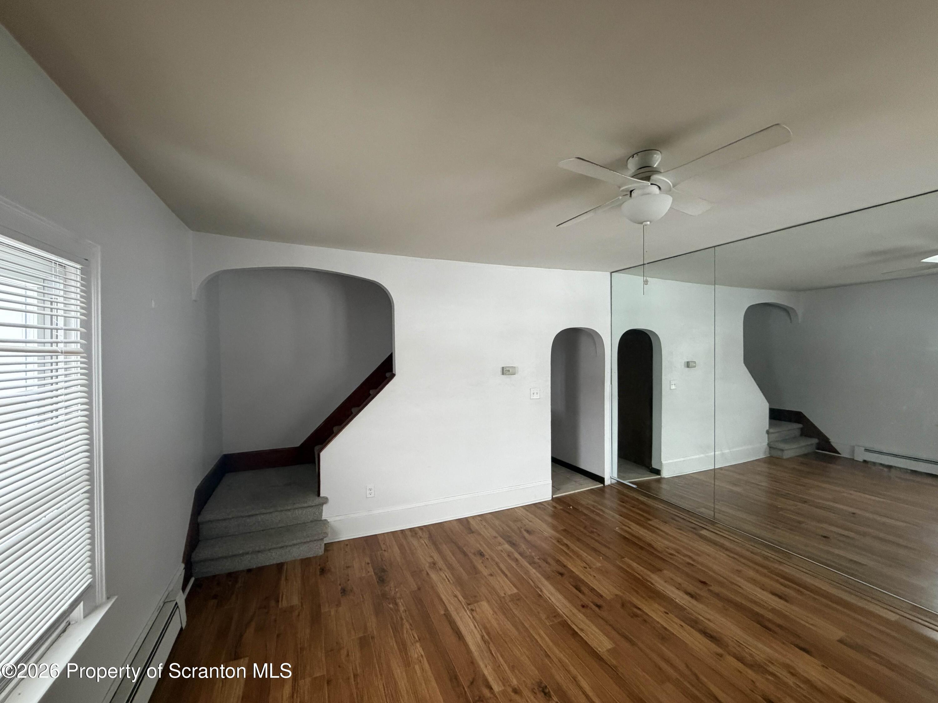 a view of a livingroom with wooden floor