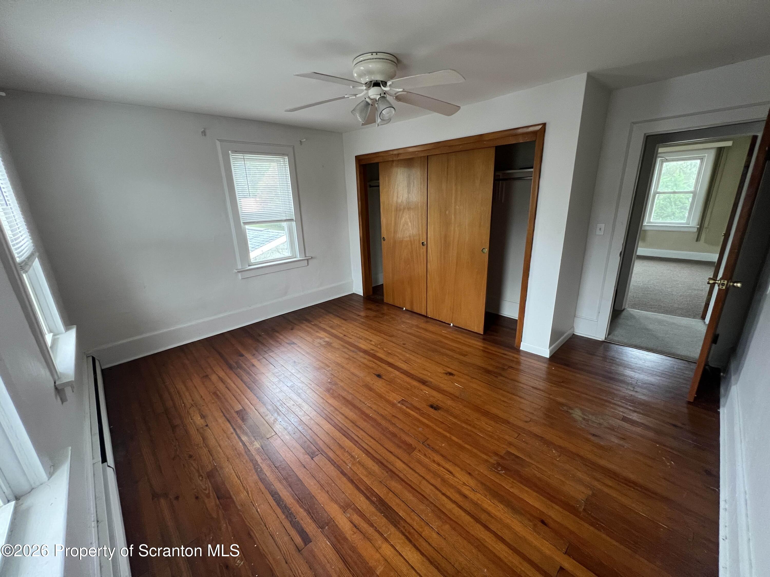 162 North Third Street Old Forge, PA 18518 - Photo 10 of 10 an empty room with wooden floor and a window