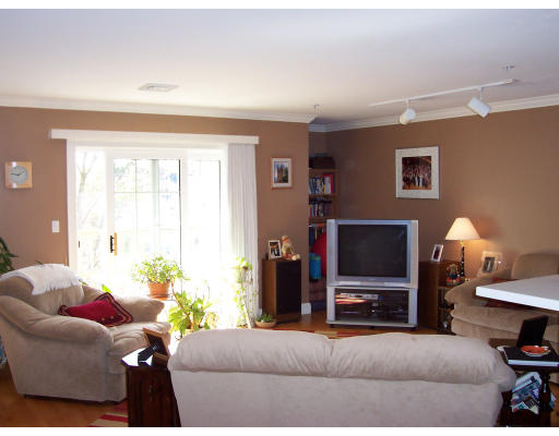 10 Forge Pond, Unit D Canton, MA 02021 - Photo 6 of 11 a living room with furniture and a flat screen tv