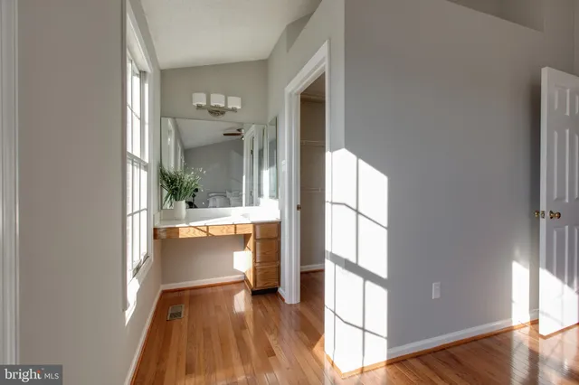 a view of an entryway with wooden floor and a window
