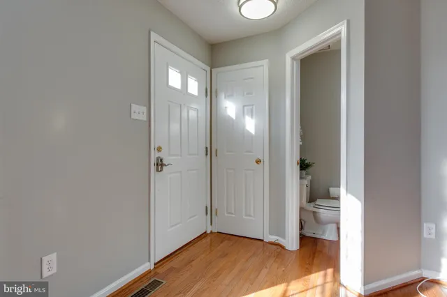 a view of a bathroom with a glass door and shower