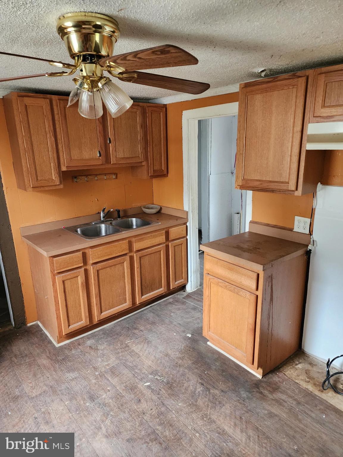 615 Center Street Laurel, DE 19956 - Photo 11 of 18 a kitchen with stainless steel appliances granite countertop a stove a sink and a refrigerator