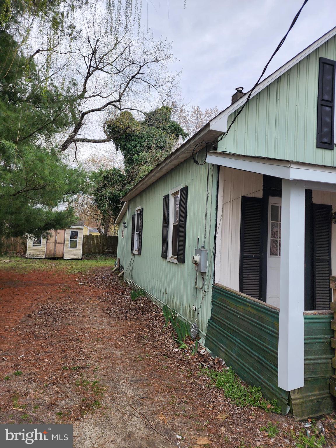 615 Center Street Laurel, DE 19956 - Photo 2 of 18 a view of backyard of house with wooden fence