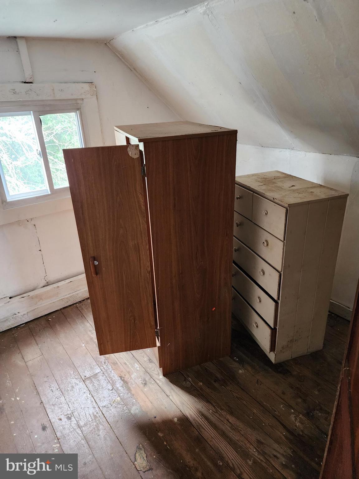 615 Center Street Laurel, DE 19956 - Photo 3 of 18 a view of a closet area with wooden floor