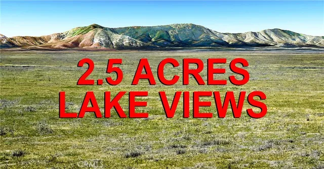 a street sign that is sitting in the middle of a field