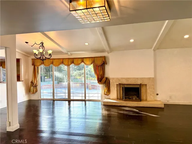 a view of livingroom with furniture wooden floor and fireplace