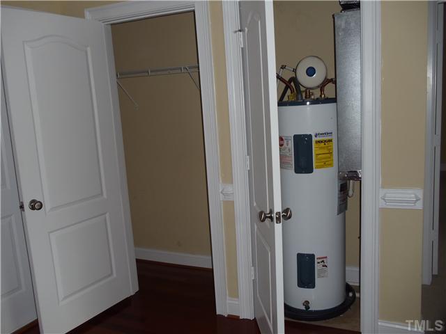 3811 Lunceston Way, Unit 305 Raleigh, NC 27613 - Photo 19 of 25 Coat closet and 50 gallon, Energy Saver electric hot water heater.
