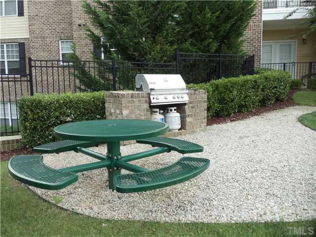 3811 Lunceston Way, Unit 305 Raleigh, NC 27613 - Photo 25 of 25 Outside there is a grilling station and a picnic table for owners use.