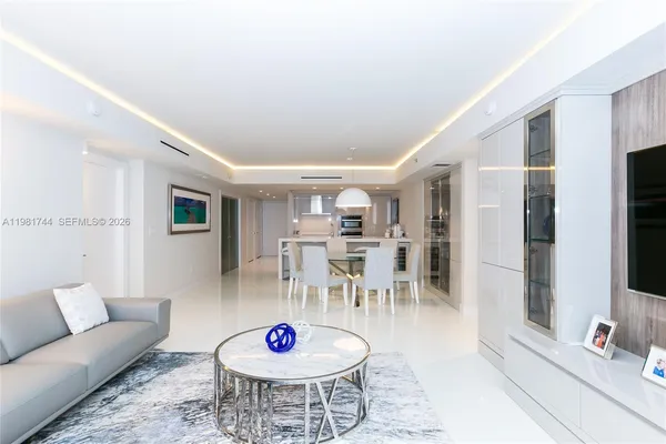 a view of a livingroom with furniture and a table