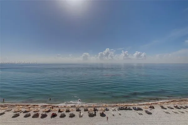 a view of a swimming pool with outdoor seating space