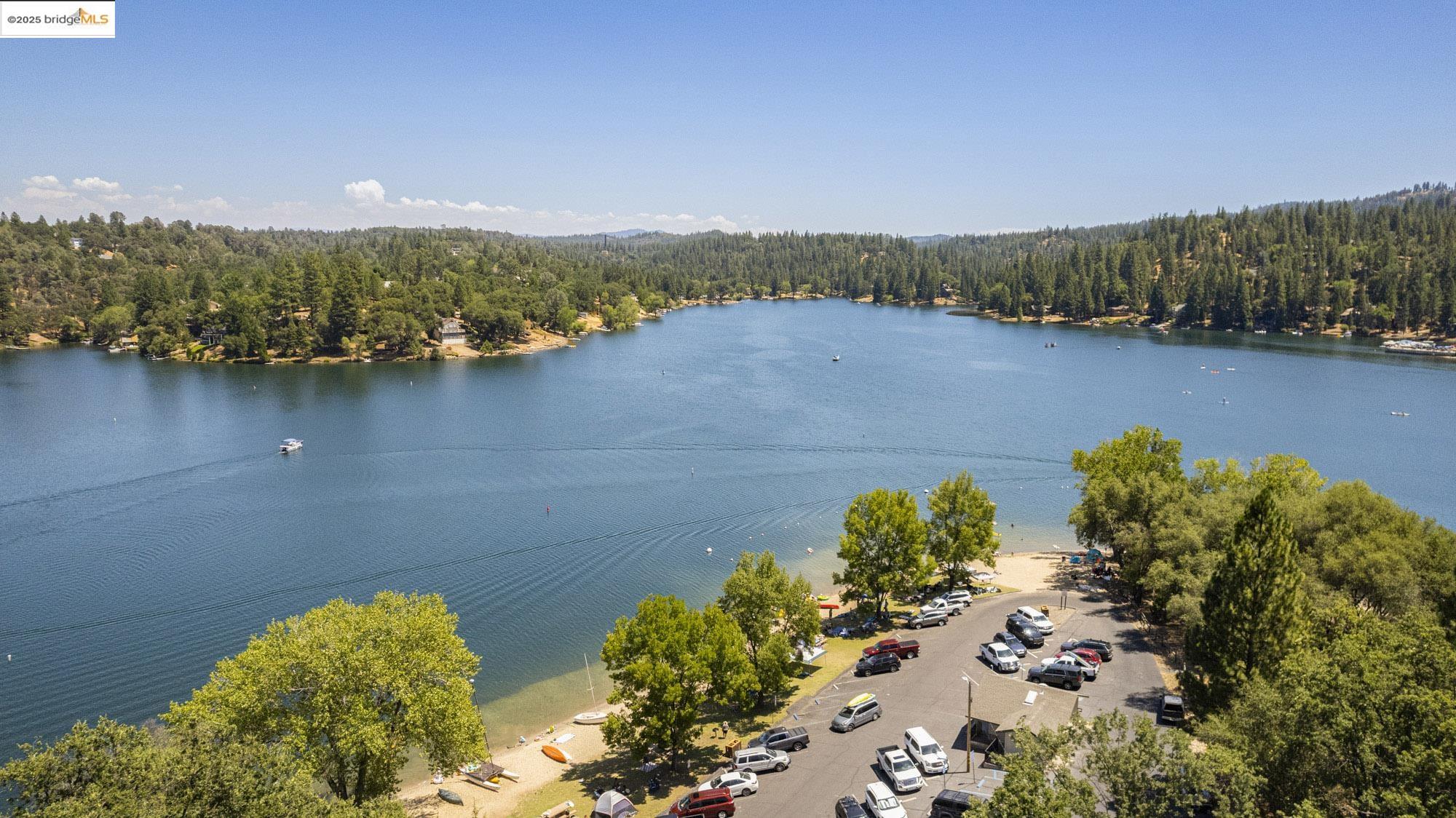 2-305 Ferretti Road Groveland, CA 95321 - Photo 20 of 25 Aerial view of a heavily wooded area and a large body of water