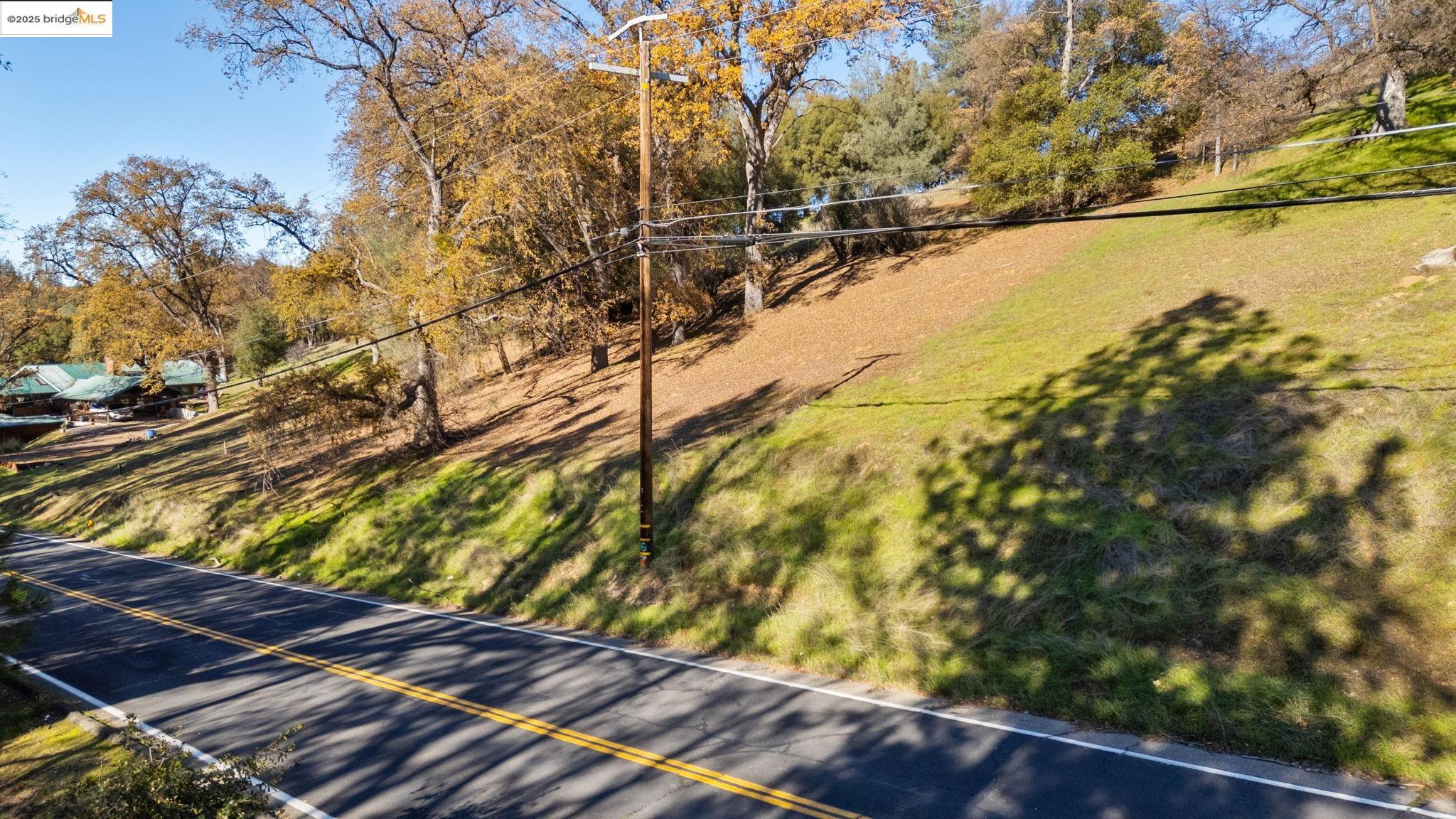 2-305 Ferretti Road Groveland, CA 95321 - Photo 3 of 25 View of green lawn featuring view of scattered trees