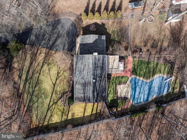 an aerial view of residential house and parking space