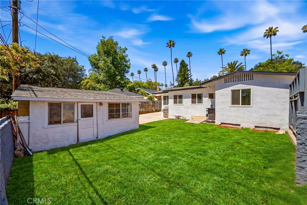 1280 East Woodbury Road Pasadena, CA 91104 - Photo 38 of 40 a view of a house with a yard