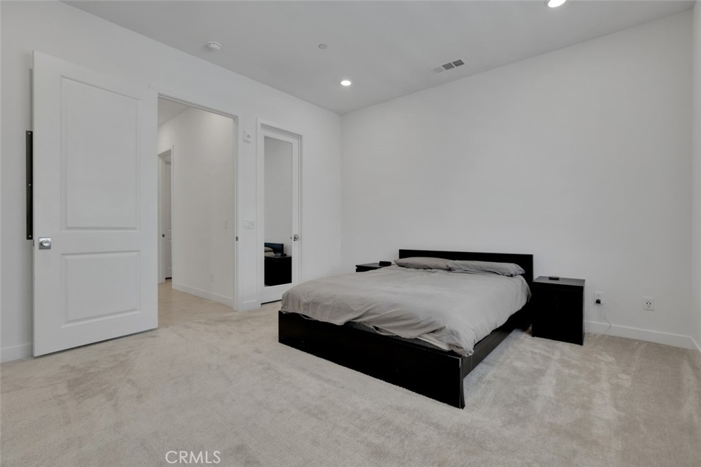 145 Sash Irvine, CA 92618 - Photo 12 of 20 a spacious bedroom with a bed and a cabinets