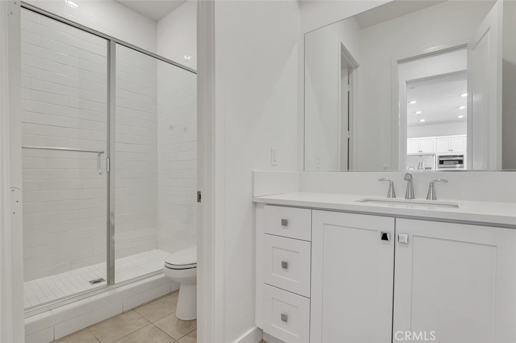 145 Sash Irvine, CA 92618 - Photo 13 of 20 a bathroom with a double vanity sink toilet and shower