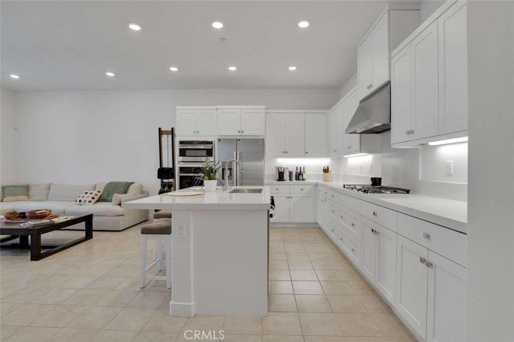 145 Sash Irvine, CA 92618 - Photo 15 of 20 a kitchen with sink refrigerator and cabinets