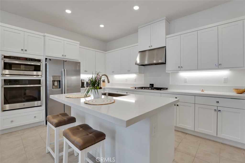 145 Sash Irvine, CA 92618 - Photo 16 of 20 a kitchen with stainless steel appliances kitchen island granite countertop a sink and cabinets