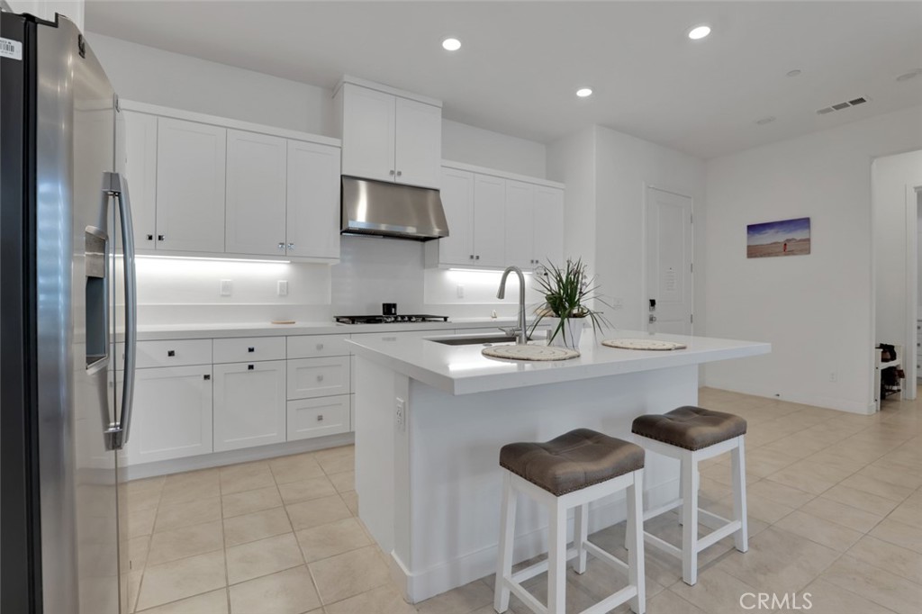 145 Sash Irvine, CA 92618 - Photo 18 of 20 a kitchen with stainless steel appliances a sink and a refrigerator