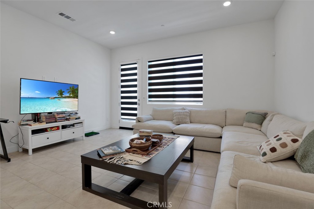 145 Sash Irvine, CA 92618 - Photo 3 of 20 a living room with furniture and a flat screen tv