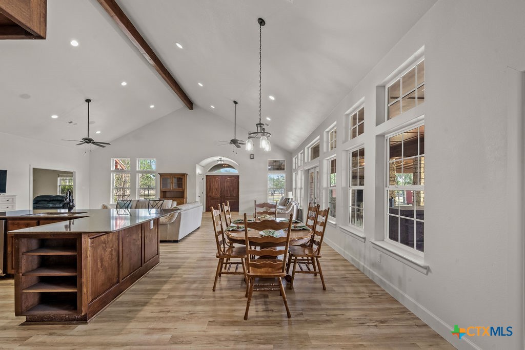 2795 Highway 290 Dripping Springs, TX 78620 - Photo 11 of 40 a view of a dining room with furniture and wooden floor