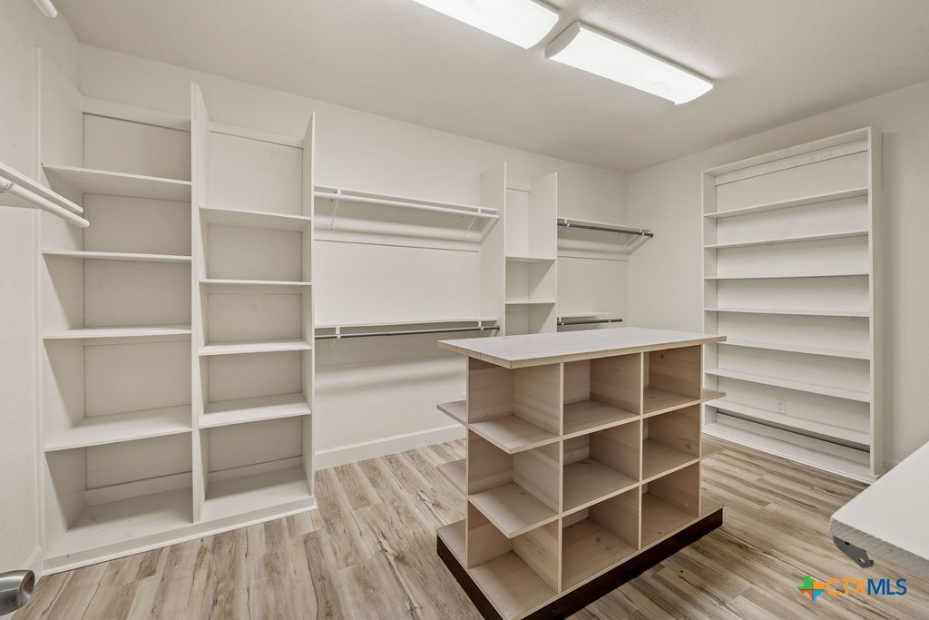 2795 Highway 290 Dripping Springs, TX 78620 - Photo 16 of 40 a view of walk in closet with empty racks