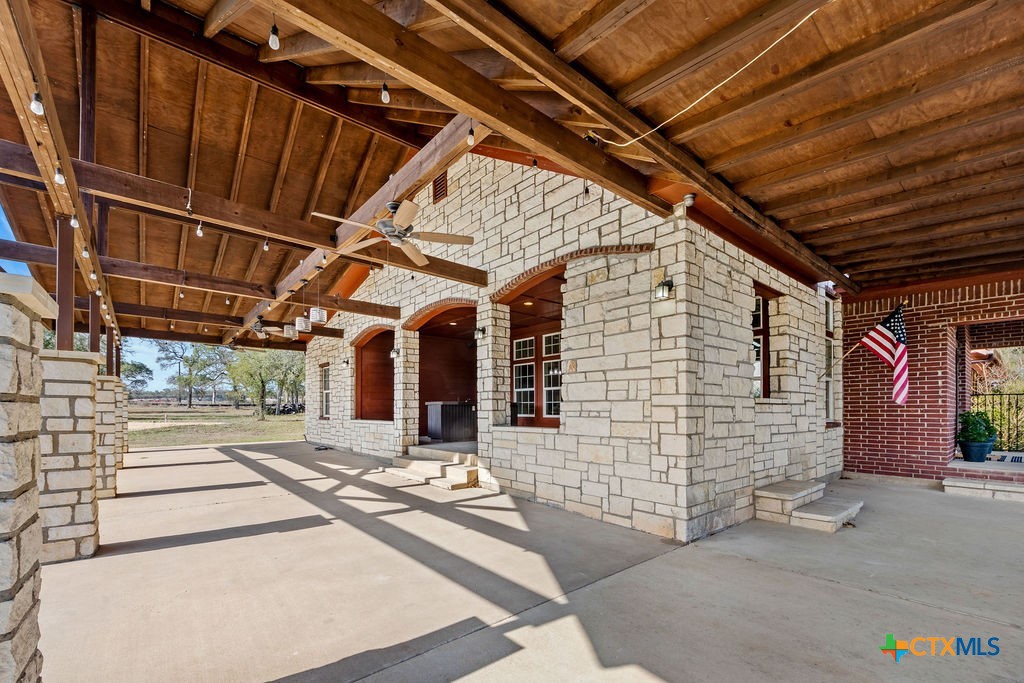 2795 Highway 290 Dripping Springs, TX 78620 - Photo 25 of 40 a view of a porch with furniture and a garage