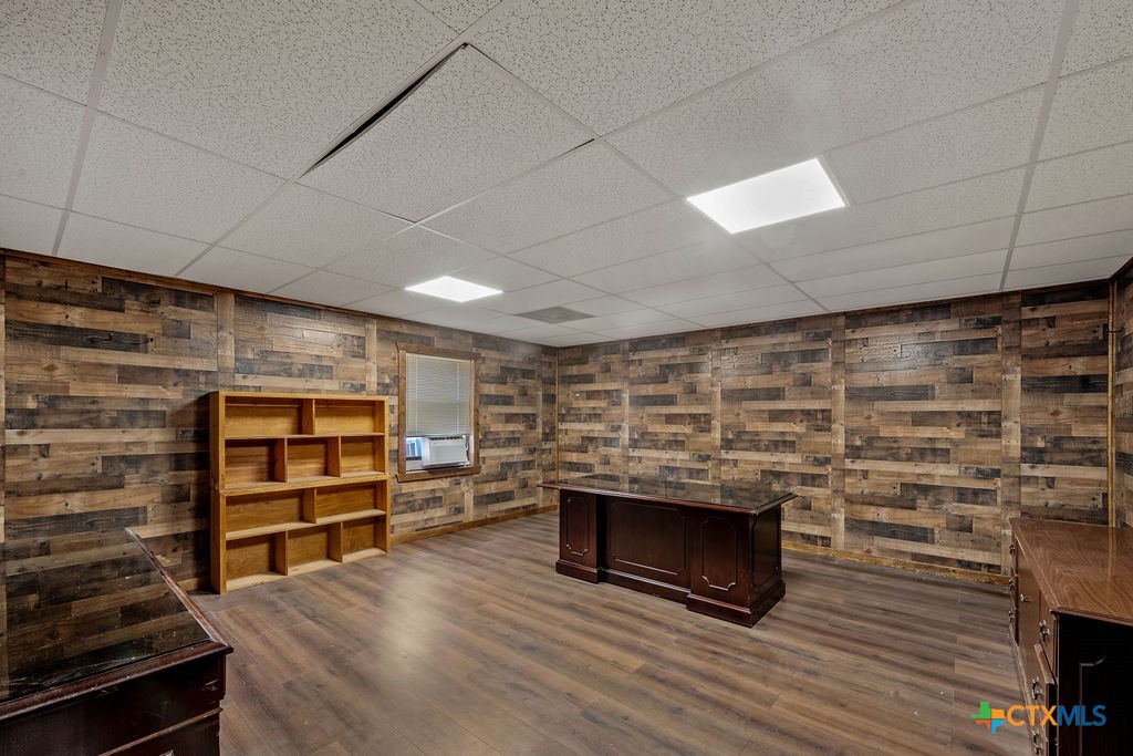 2795 Highway 290 Dripping Springs, TX 78620 - Photo 33 of 40 a view of an empty room with wooden floor and a fireplace
