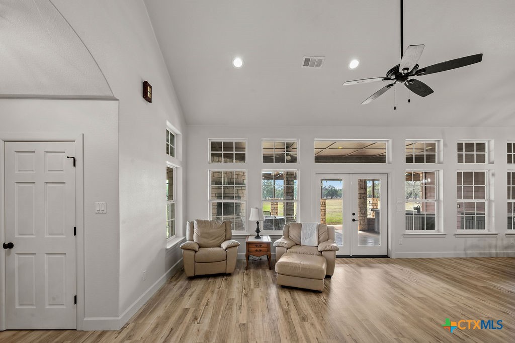 2795 Highway 290 Dripping Springs, TX 78620 - Photo 4 of 40 a living room with furniture window and wooden floor